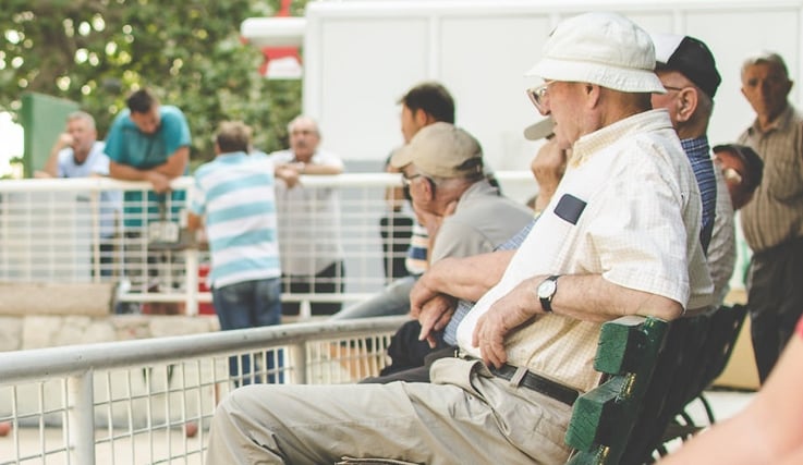 baby boomers sitting on a bench outside.jpg